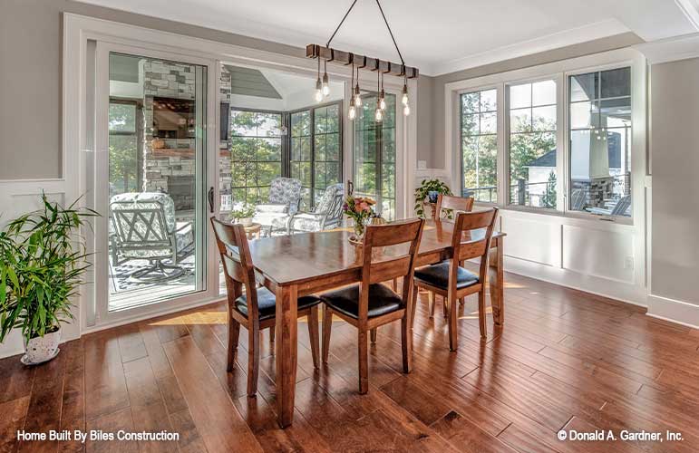 Bright natural light with large windows and sliding glass door in the dining room