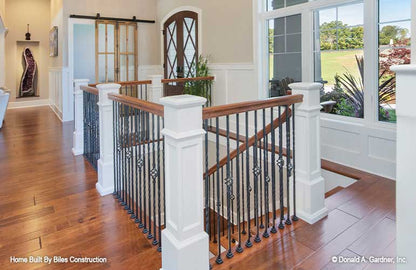 Large windows over the stairs leading to the lower level. 