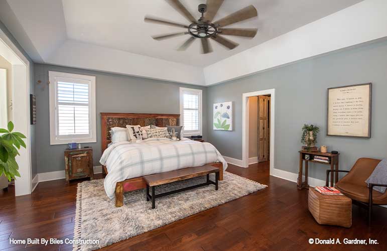 Spacious master bedroom featured with tray ceilings.