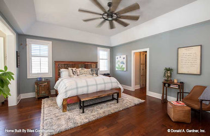 Spacious master bedroom featured with tray ceilings.