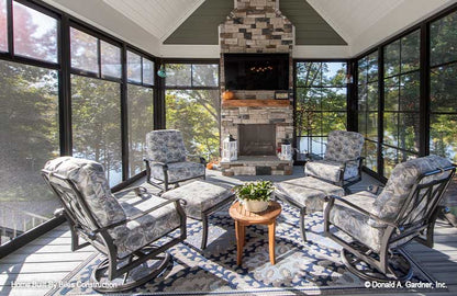 Gorgeous screened in patio with fireplace.