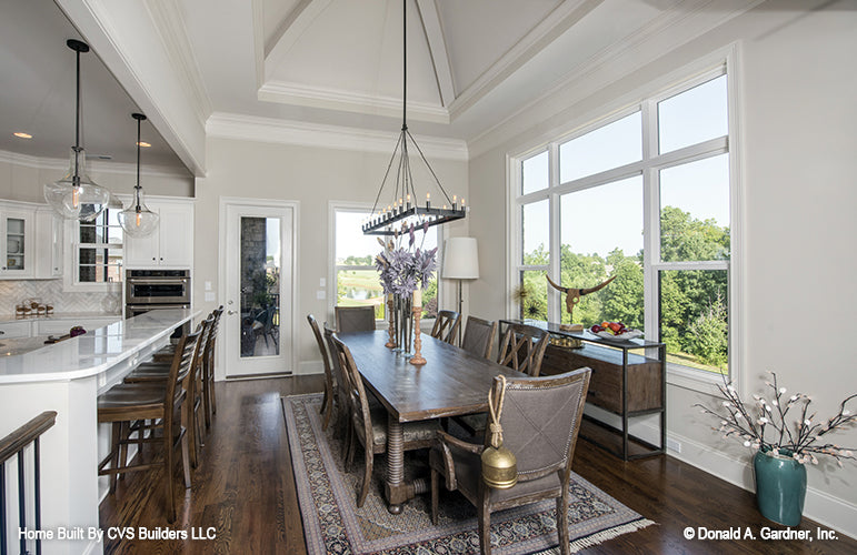 Chandelier over the table in the dining room. The Monarch Manor plan 5040.