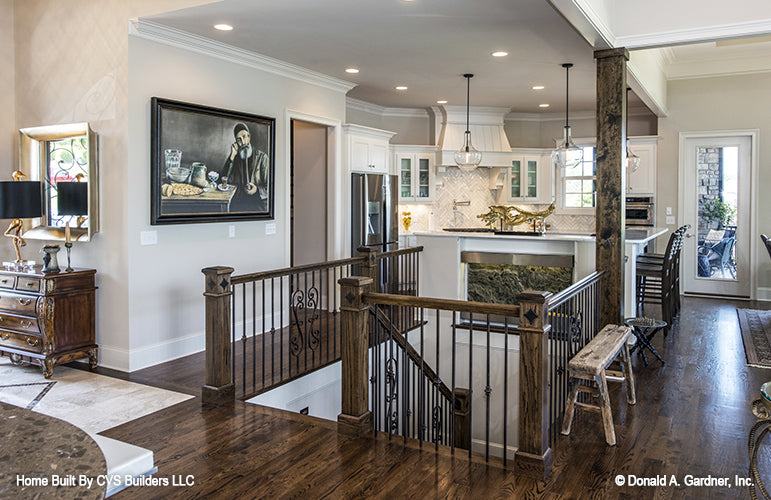 Iron spindles on the staircase to the basement. The Monarch Manor plan 5040.