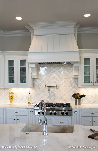 White range hood in the kitchen. The Monarch Manor plan 5040.