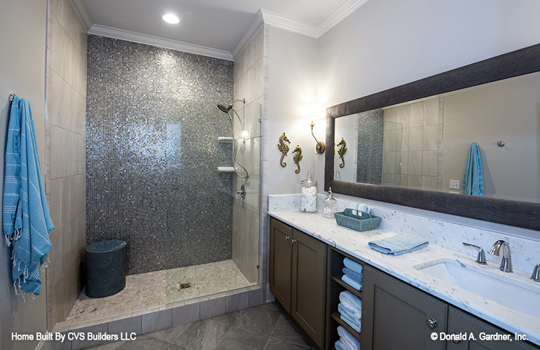 Double sink vanity next to walk-in shower. The Monarch Manor plan 5040.