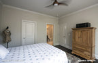 Crown molding along the ceiling int he bedroom. The Monarch Manor plan 5040.