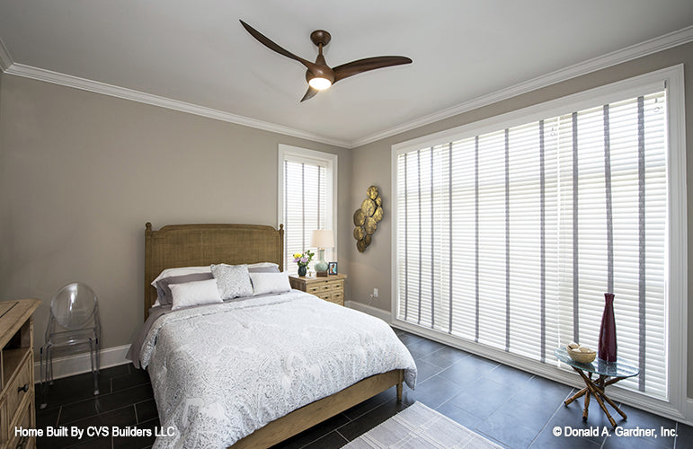 Floor to ceiling large window in the bedroom. The Monarch Manor plan 5040.