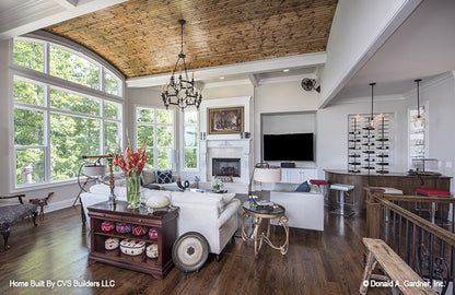 Curved wood panel ceiling in the great room. The Monarch Manor plan 5040.