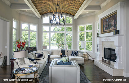 Chandelier and recessed lighting in the great room. The Monarch Manor plan 5040.