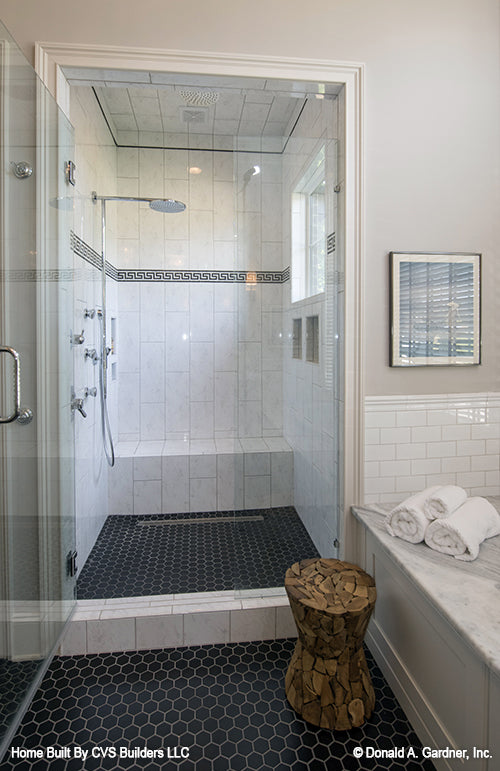 Tiled walk-in shower in the master bathroom. The Monarch Manor plan 5040.