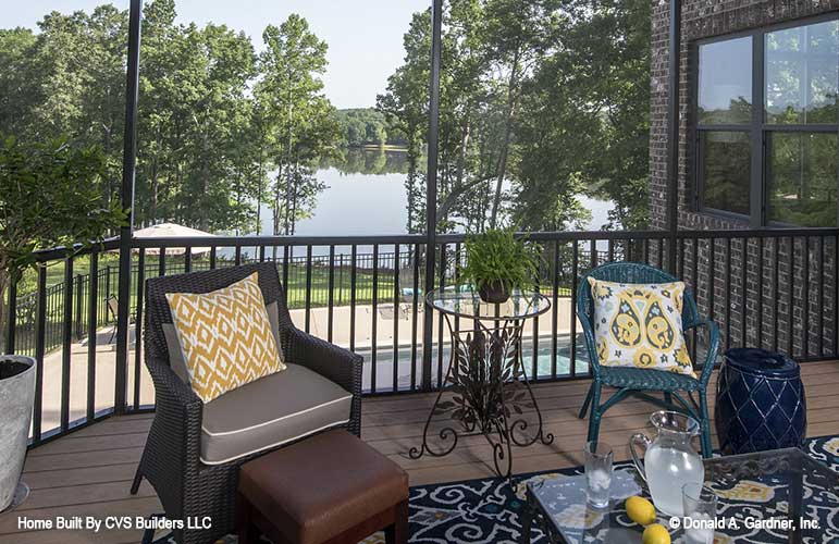 Seating in the screened in porch. The Monarch Manor plan 5040.