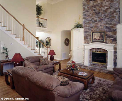 This is a picture of fireplace and great room of four bedroom house plan 483 The Montpelier