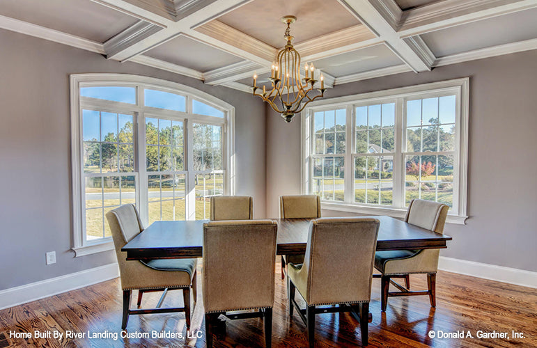 Coffered ceiling and arched window in the dining room. The Newcastle plan 994.