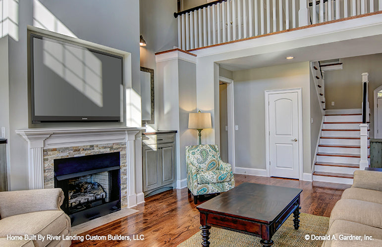 Fireplace and mantle in the great room. The Newcastle plan 994.