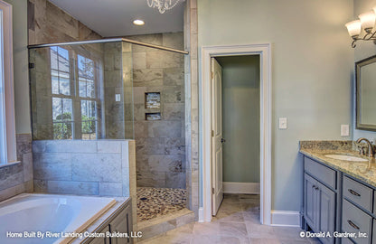 Tiled walk-in shower in the master bathroom. The Newcastle plan 994.