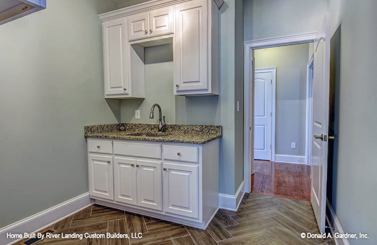 Cabinets and sink in the utility room. The Newcastle plan 994.