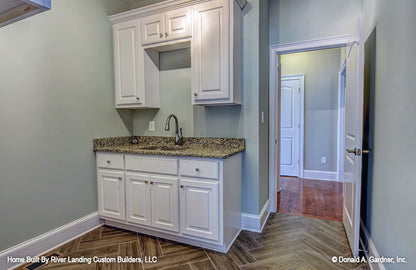 Cabinets and sink in the utility room. The Newcastle plan 994.