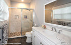 Single sink vanity and walk-in shower in the bathroom. The Nicholette plan 1520.