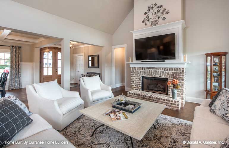 Brick fireplace with mantel in the great room. The Nicholette plan 1520.