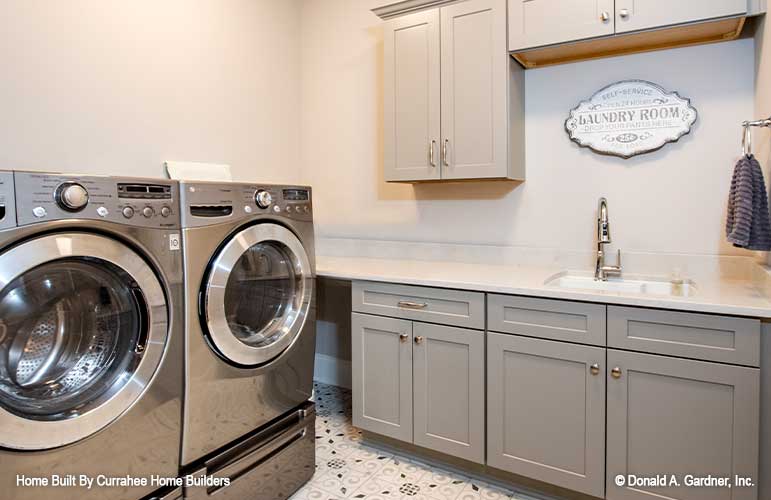 Sink and cabinets in the utility room. The Nicholette plan 1520.