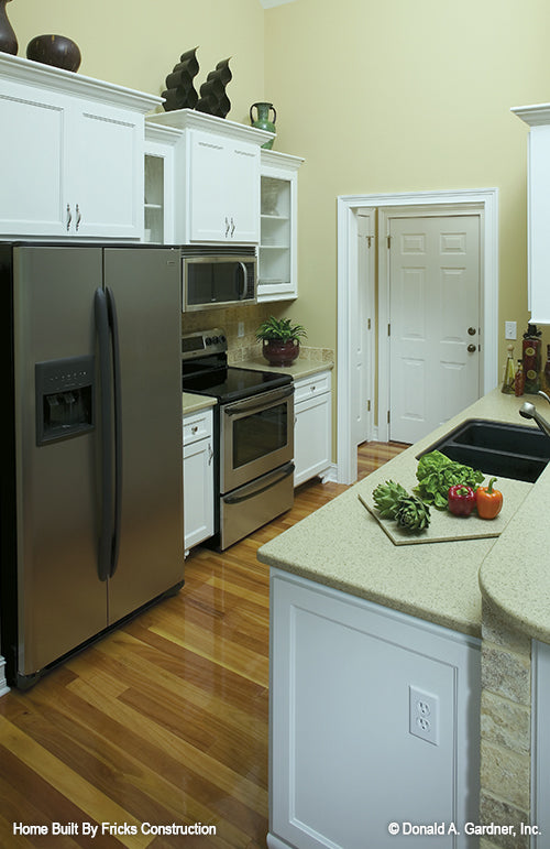 White cabinets in the kitchen. The Nicholson plan 1021.