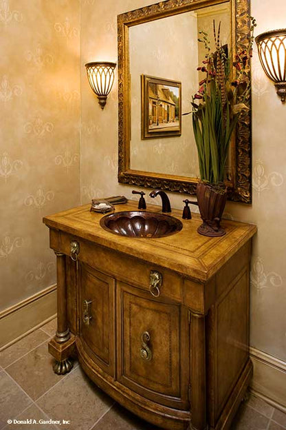 Single sink vanity with mirror in the bathroom. The Oak Abbey plan 5003.