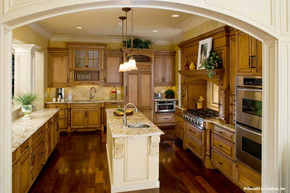 Arched entry way leading to the kitchen. The Oak Abbey plan 5003.