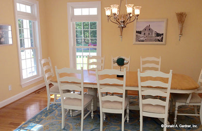 Chandelier and wood floors in the dining room. The Oakmont plan 318.