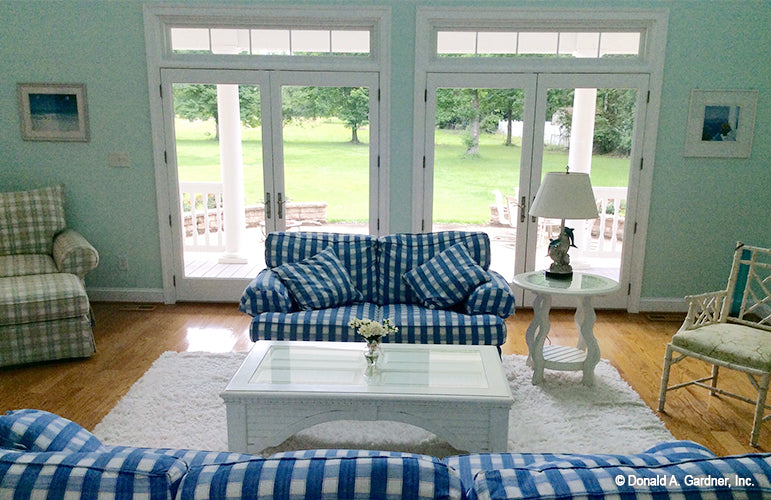 Two sets of French glass patio doors in the great room. The Oakmont plan 318.