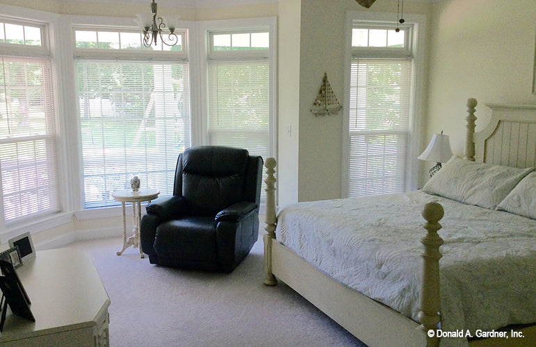 Sitting area with hanging lighting in the master bedroom. The Oakmont plan 318.