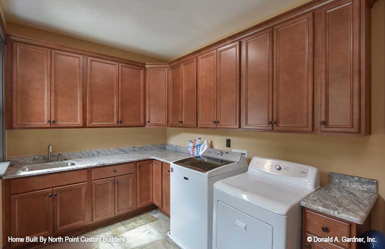 Roomy utility room with utility sink for plan 1427 The Oliver