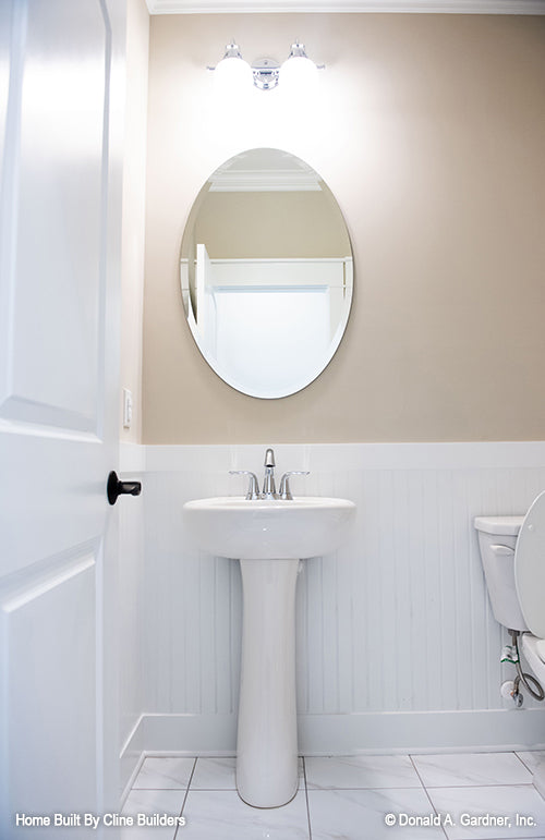 Light and spacious powder room pictured for plan 1428 The Oscar