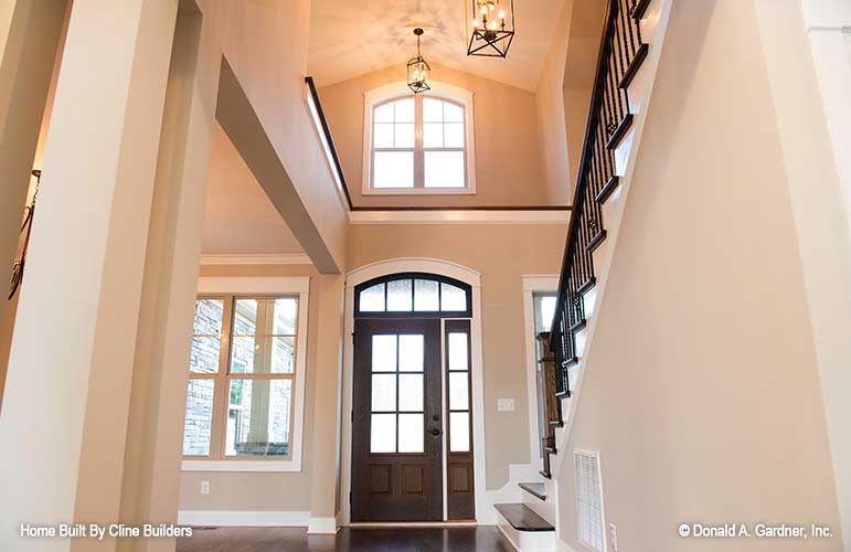 Grand foyer view with two-story ceiling pictured for plan 1428 The Oscar