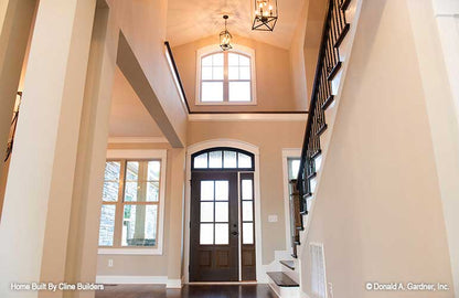 Grand foyer view with two-story ceiling pictured for plan 1428 The Oscar