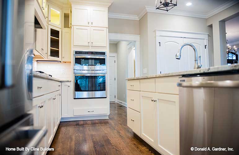 Generously sized kitchen for plan 1428 The Oscar shown in this picture of island and countertops