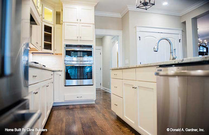 Generously sized kitchen for plan 1428 The Oscar shown in this picture of island and countertops