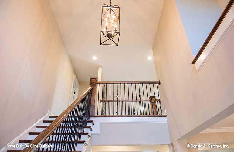 Picture shows two story foyer with chandelier for plan 1428 The Oscar