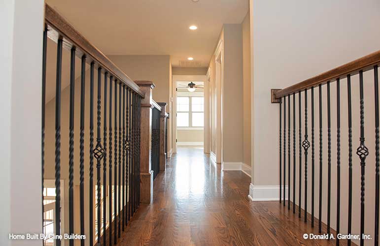 Detailed railing shown in the second story overlook to great room for plan 1428 The Oscar