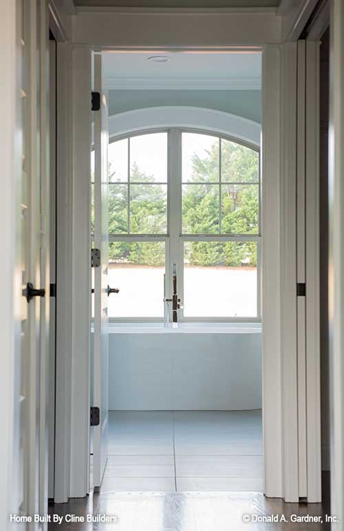 Grand entrance to the master bath shown in picture for plan 1428 The Oscar