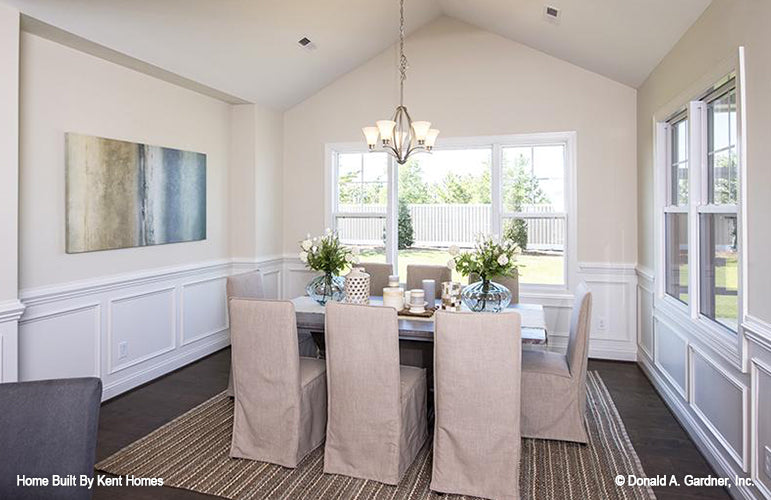 Large windows and cathedral ceiling in the dining room. The Padgett plan 1124.