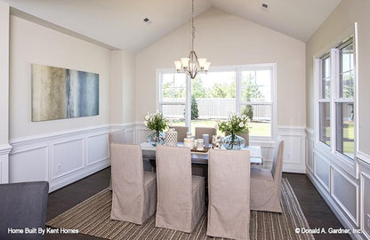 Large windows and cathedral ceiling in the dining room. The Padgett plan 1124.