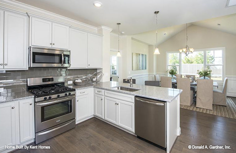 Kitchen and dining room open floor plan. The Padgett plan 1124.