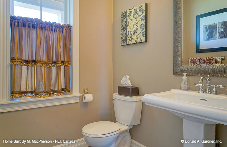 Single window and pedestal sink in the bathroom. The Palm Lily plan 845. 