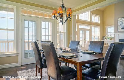 Crown molding along the ceiling in the dining room. The Palm Lily plan 845. 