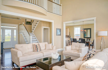 Great room view to the staircase and loft above. The Palm Lily plan 845. 