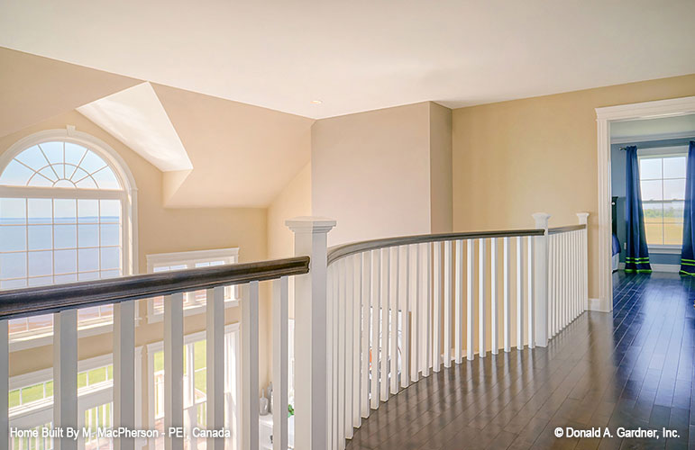 Loft view to the second story great room windows. The Palm Lily plan 845. 