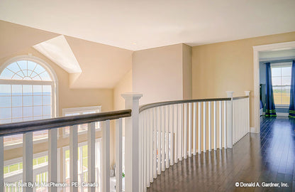 Loft view to the second story great room windows. The Palm Lily plan 845. 