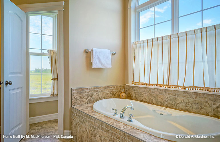 Soaking tub in the master bathroom. The Palm Lily plan 845. 