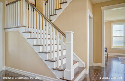 Wood and white accents on the stairs. The Palm Lily plan 845. 