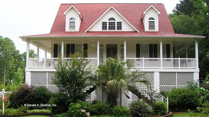 This is a photograph of the front of coastal house plan 737 The Palmetto as built by a customer